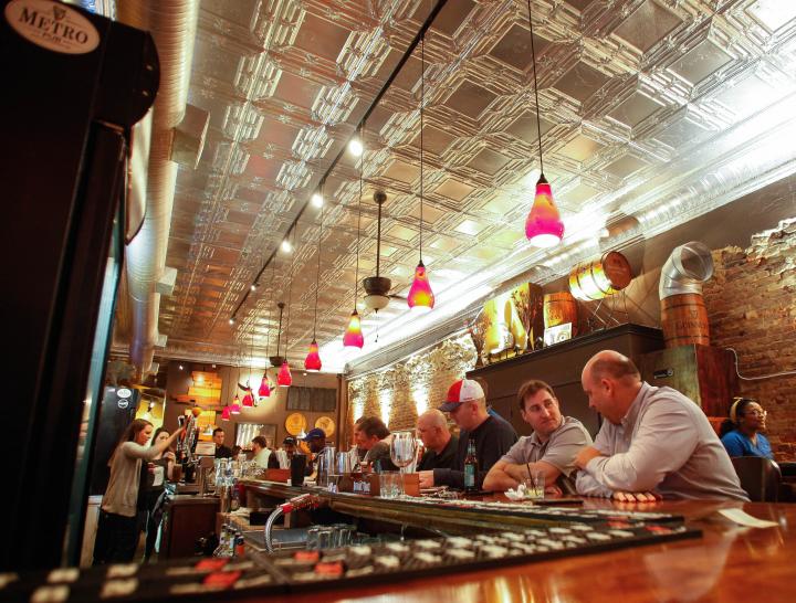 Looking down the bar from a secluded corner